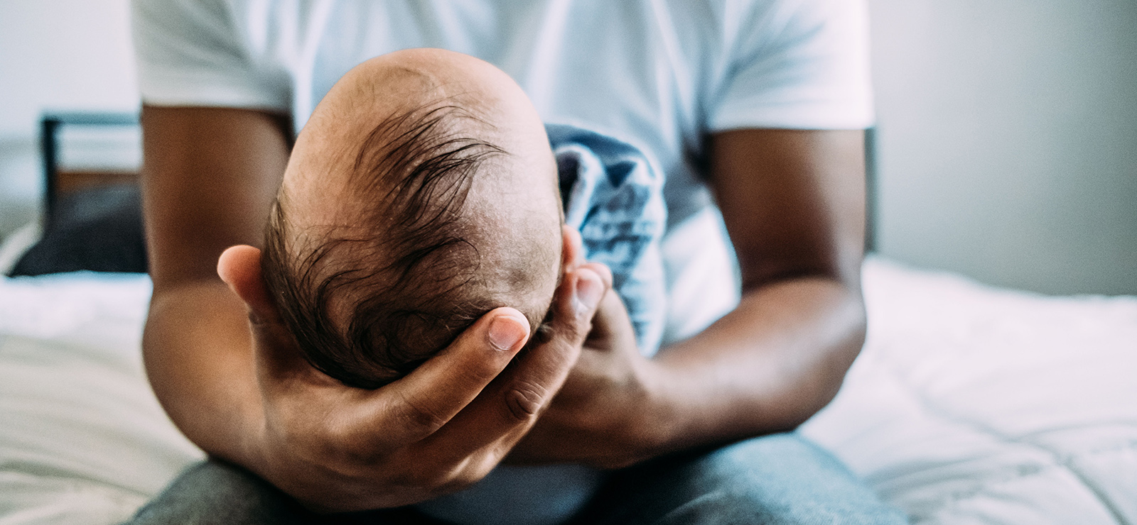 man holding an infant