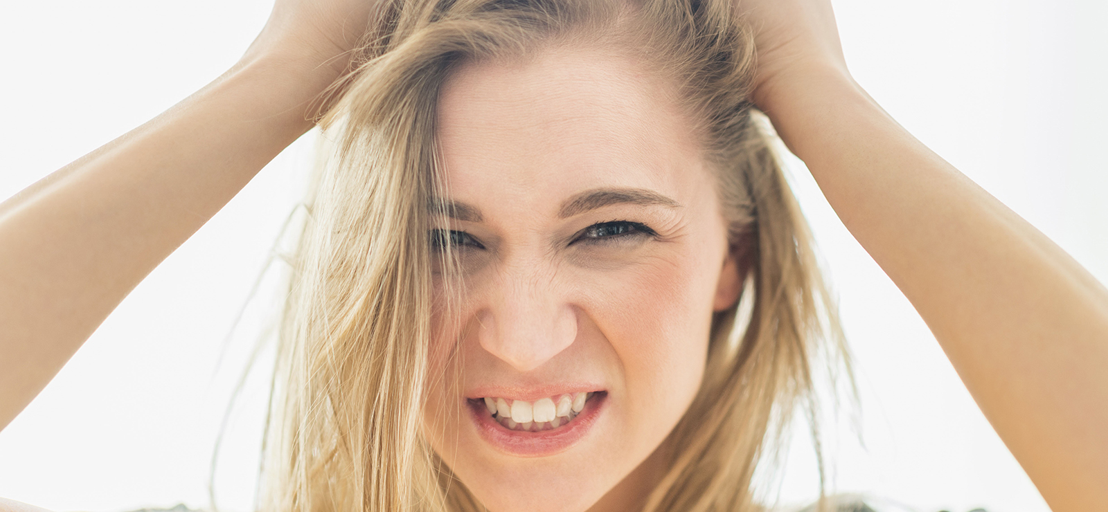 frustrated woman pulling out her hair