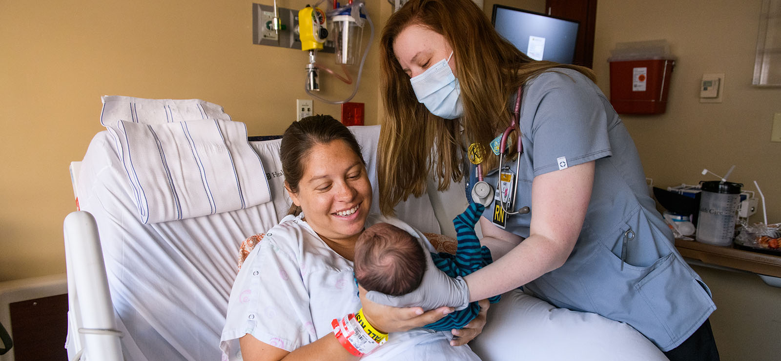 doctor with patient in hospital bed