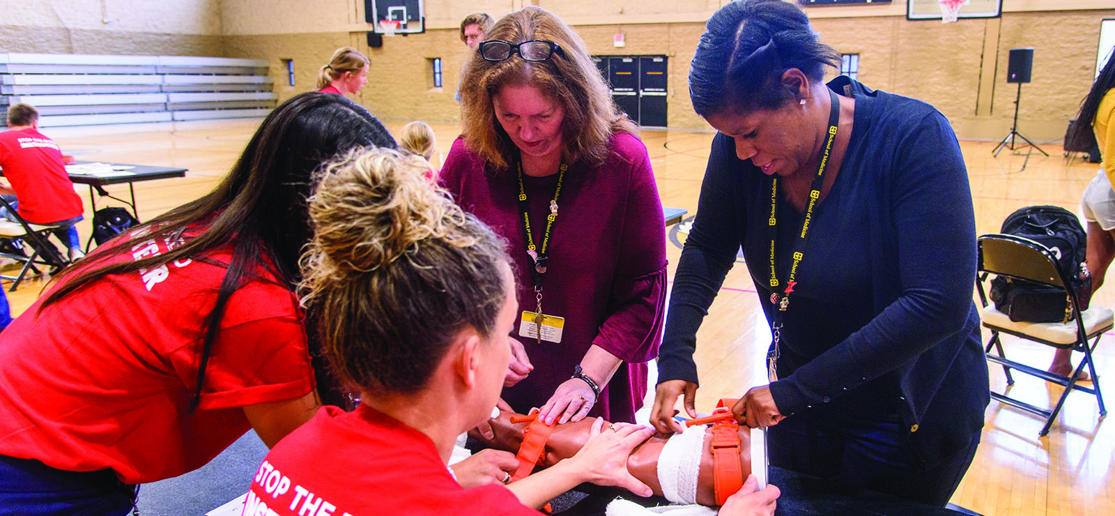 Group doing stop the bleed training