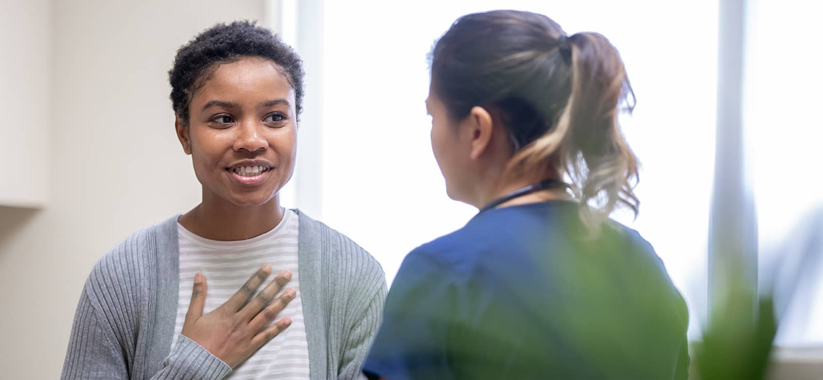 Milennial woman talking with a doctor