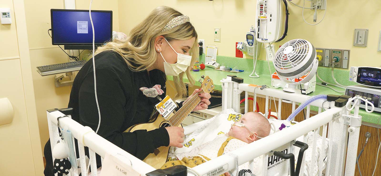 Emily Pivovarnik singing to baby