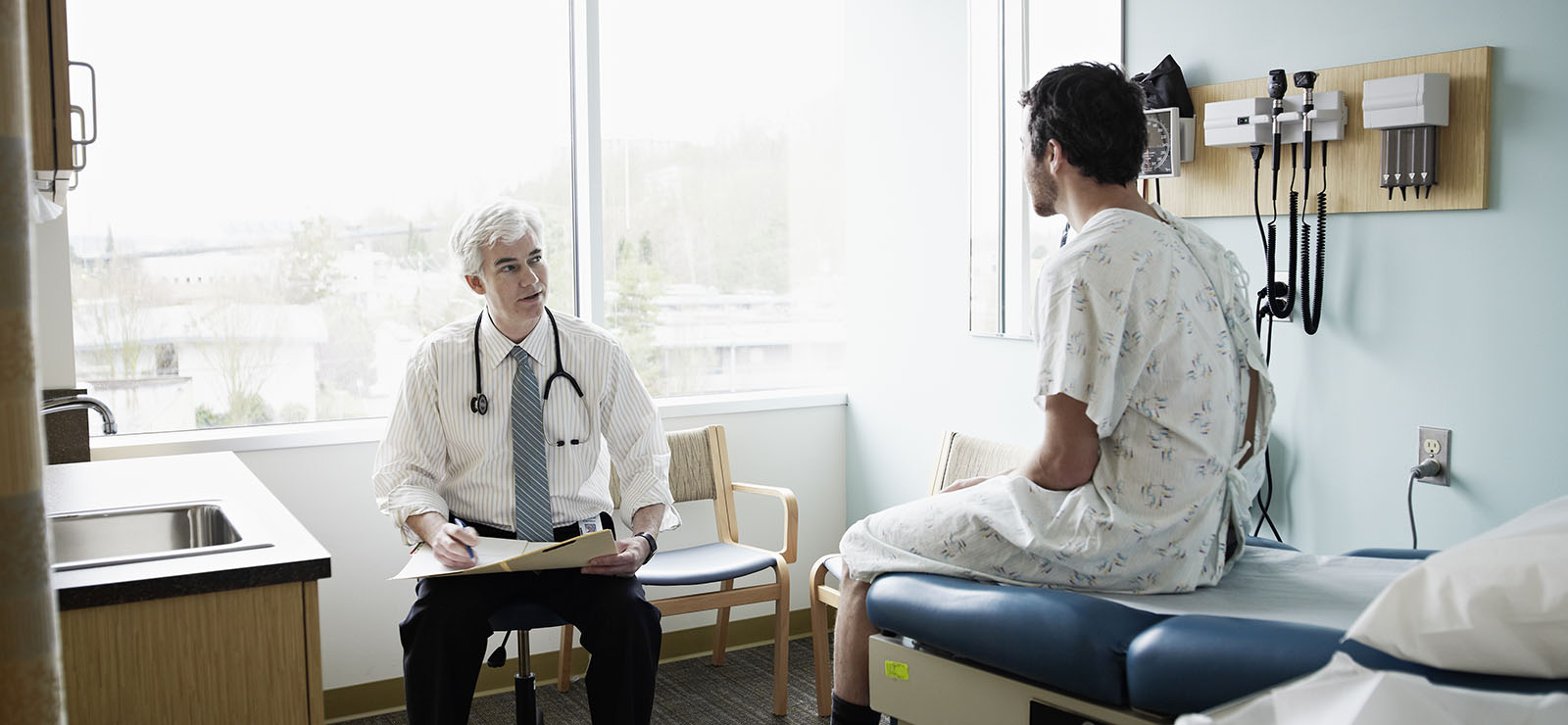 male doctor with male patient