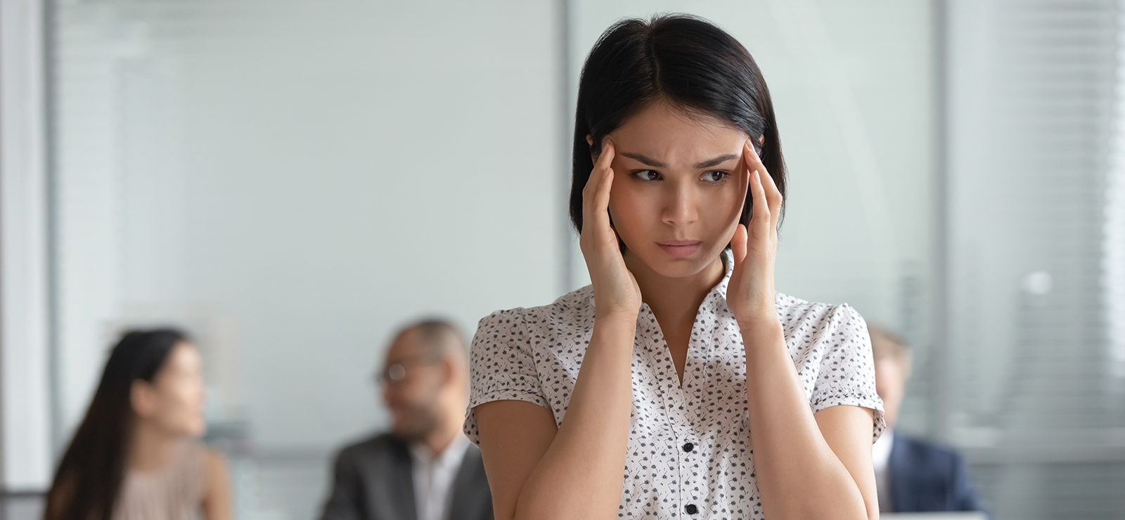 woman holding her head