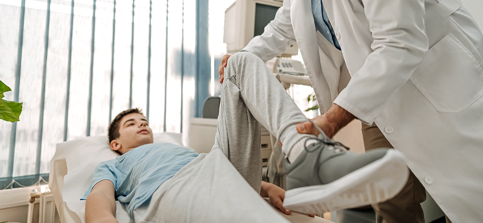 young man being examined by doctor