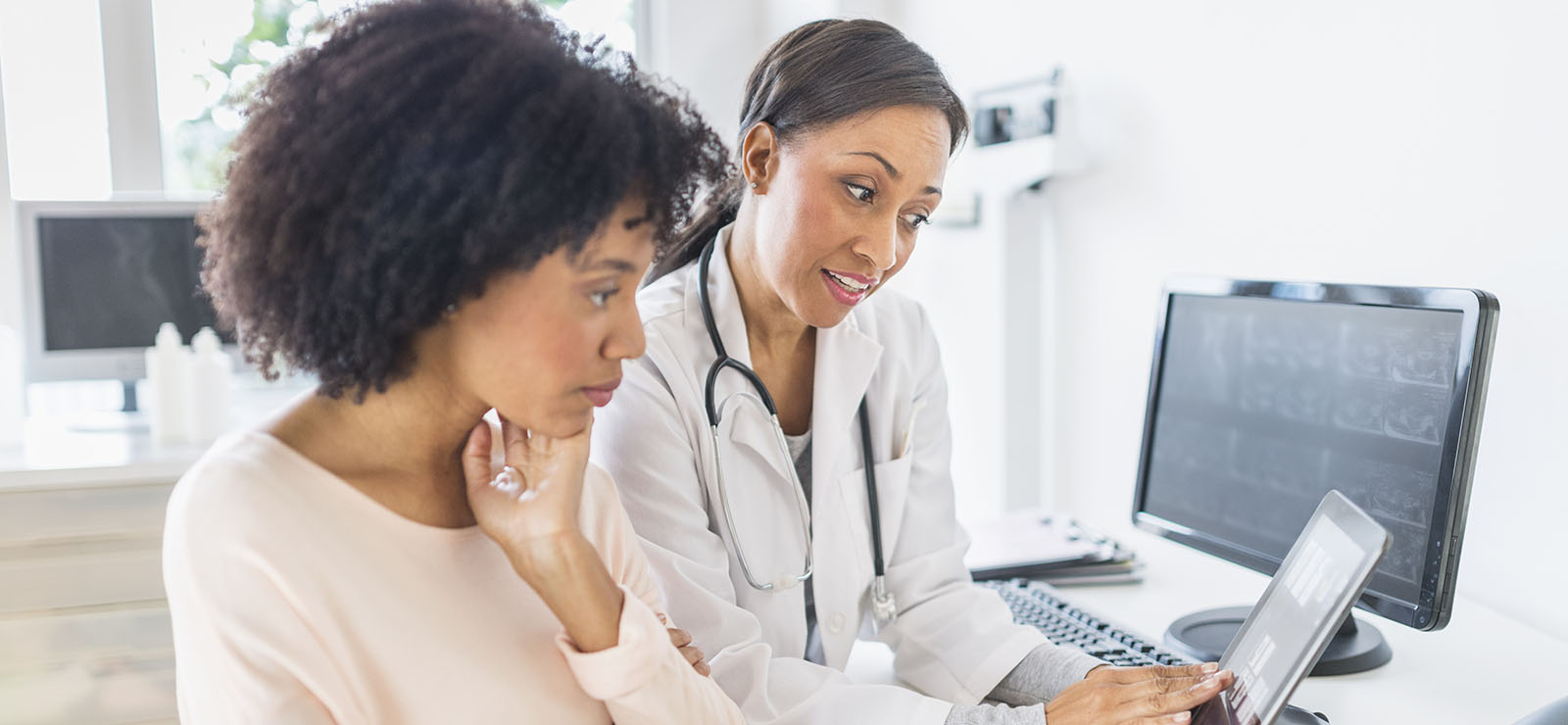 female doctor with female patient