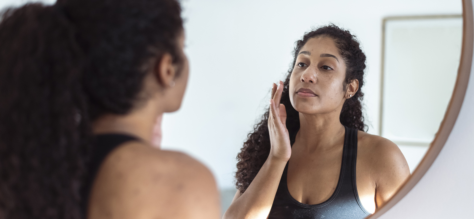 woman looking the mirror