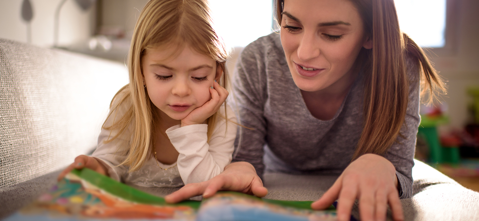 mother and child reading together