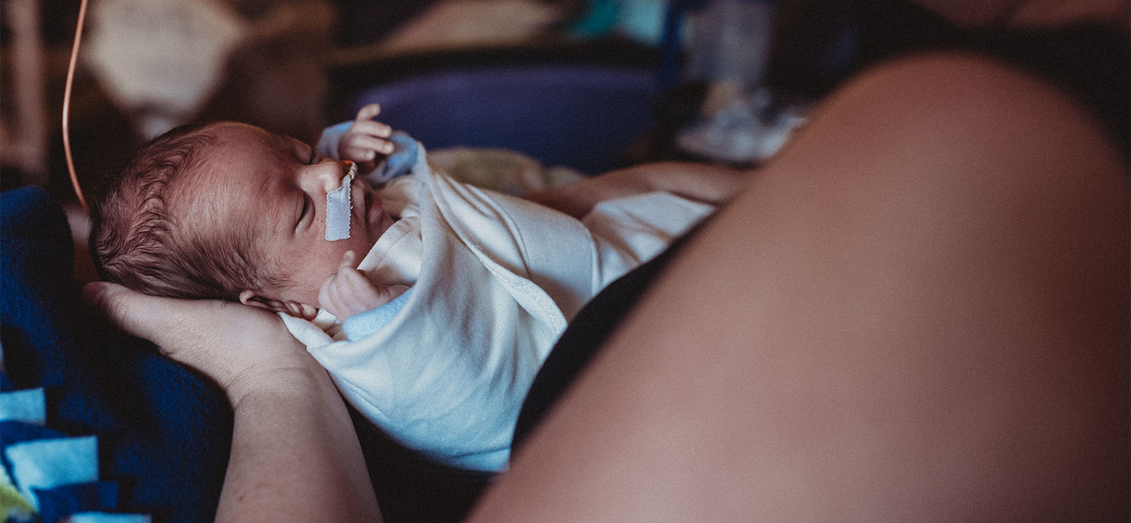 mother holding infant