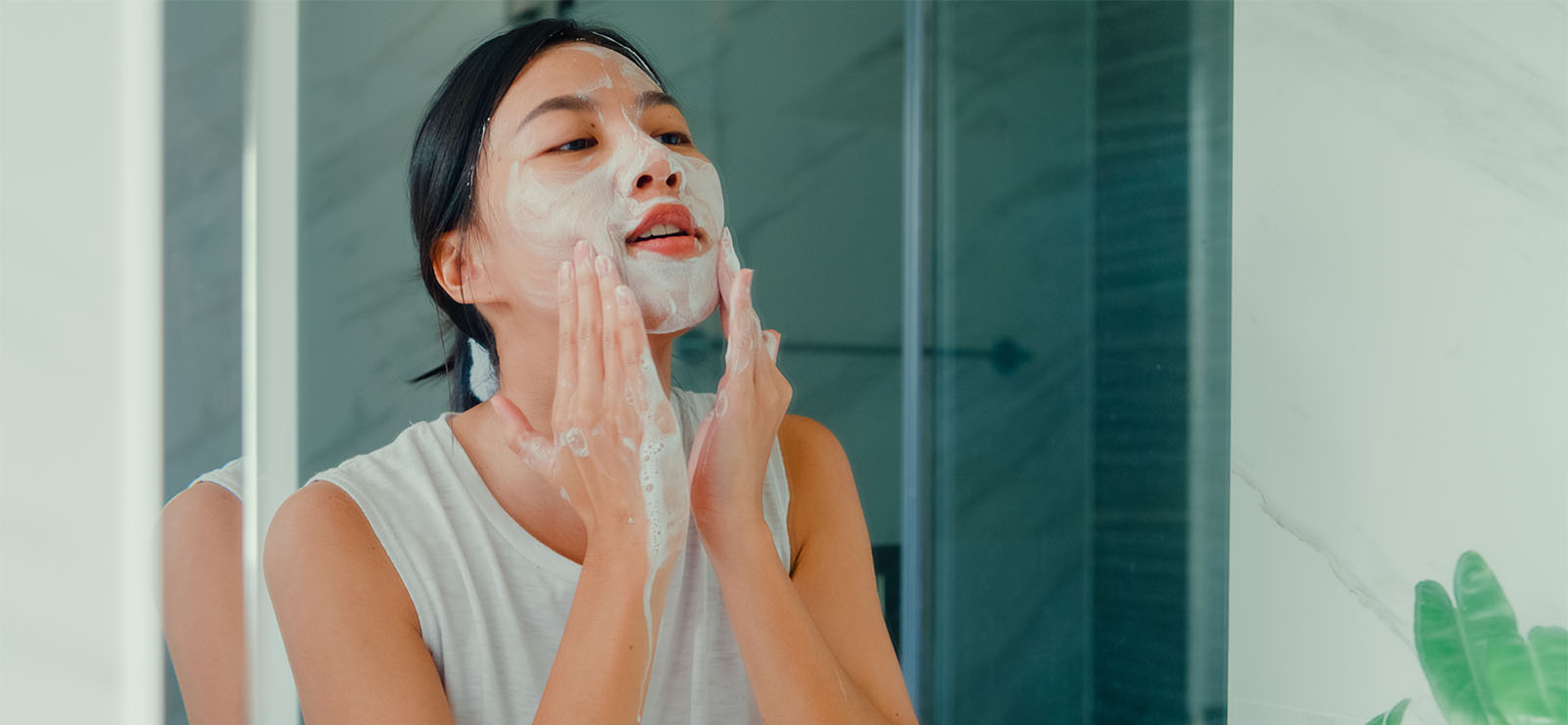 woman washing her face