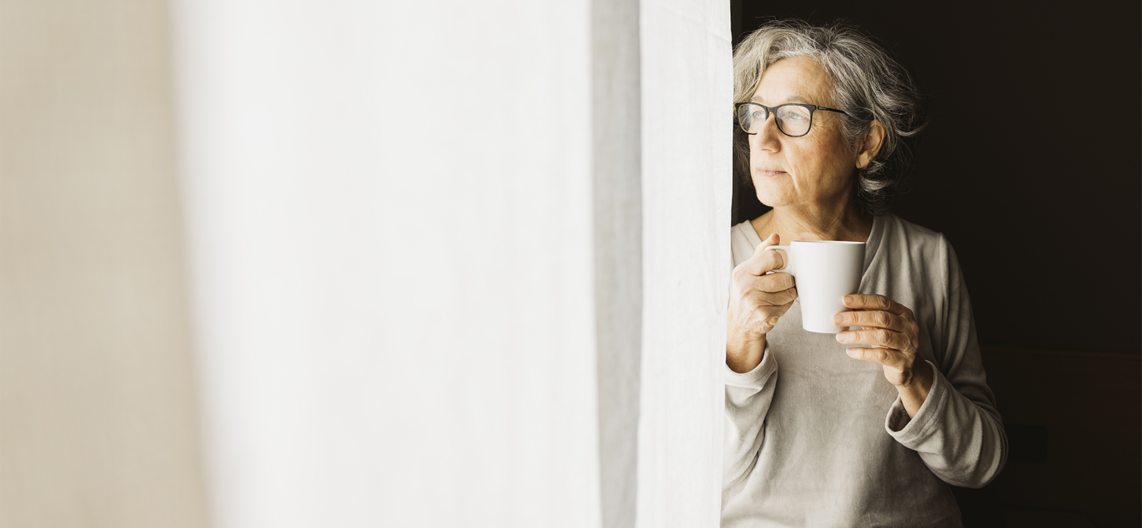 A woman holding a mug.