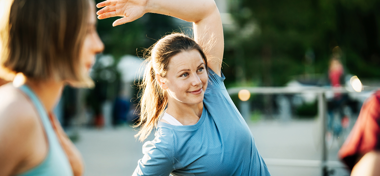 a woman stretching outdoors