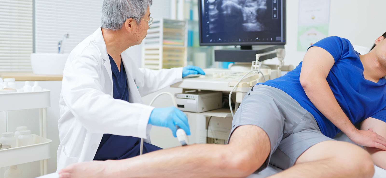 A physician using a machine to examine a patient.