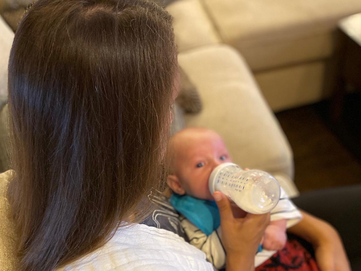 woman feeding baby