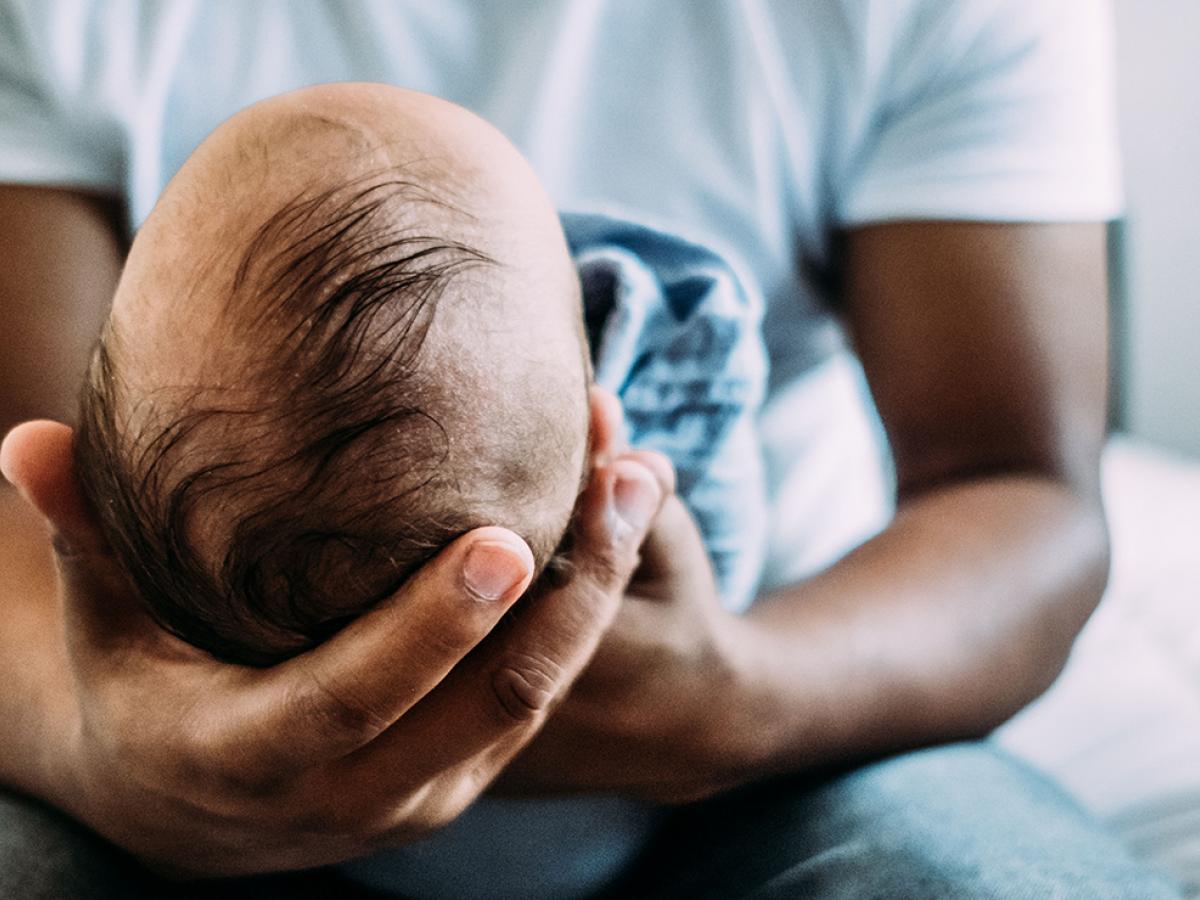 man holding an infant