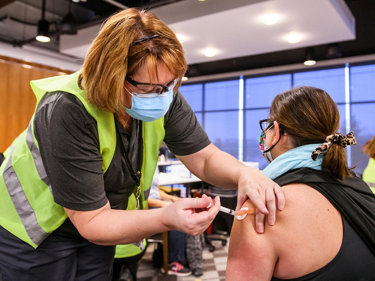 Person receiving the COVID-19 vaccination