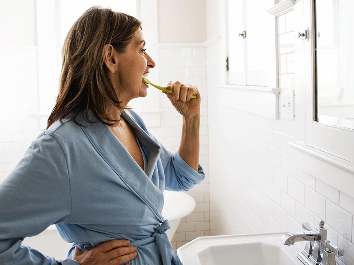 Woman brushing her teeth