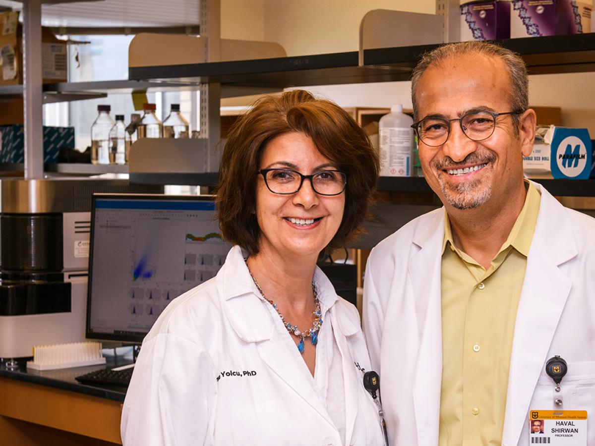 Dr. Shirwan and Dr. Yolcu in a research lab