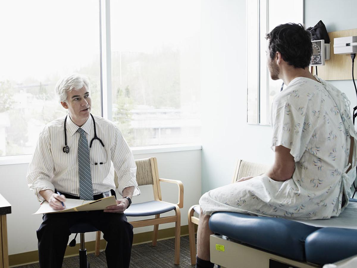 male doctor with male patient