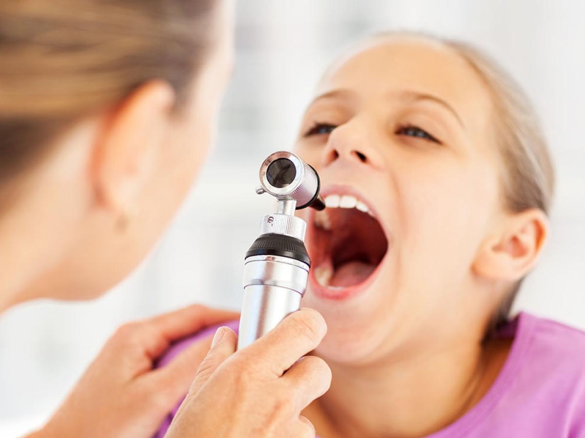 child being examined by doctor