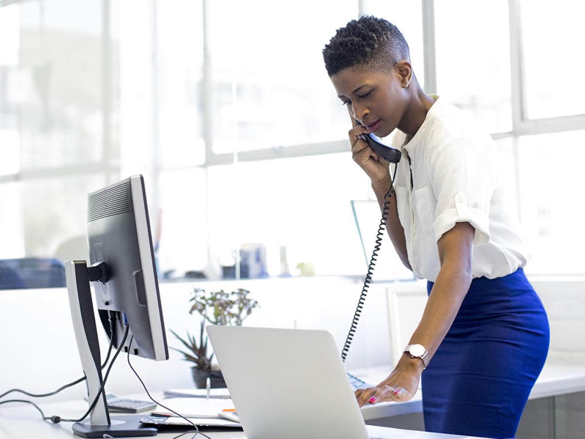 woman standing while working