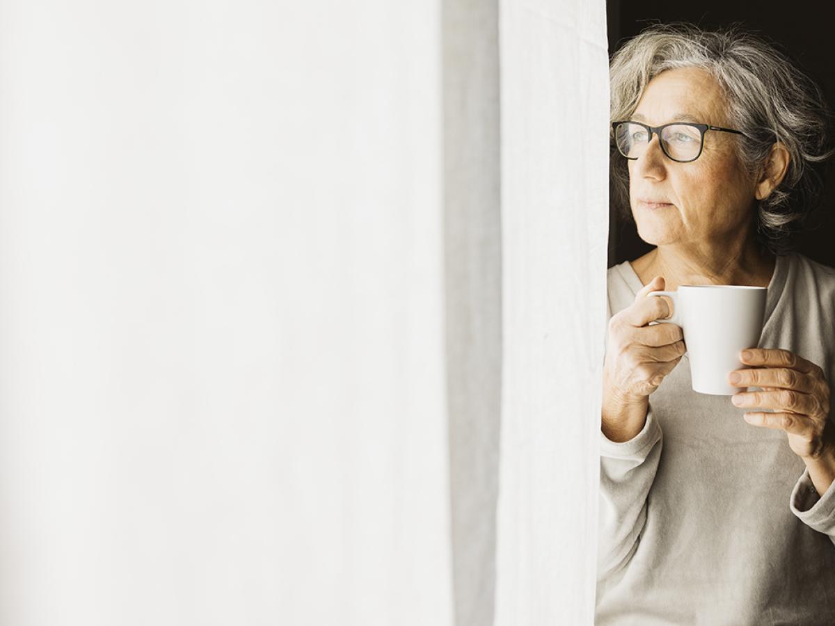 A woman holding a mug.