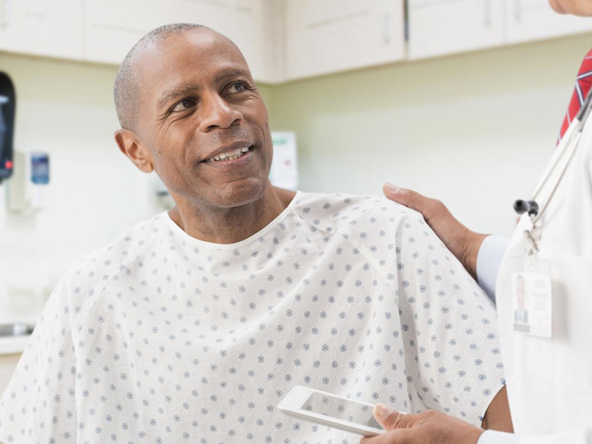 A male patient speaking with his doctor.