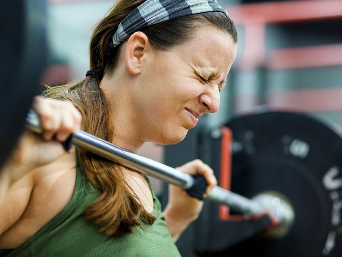 A woman lifting weights.