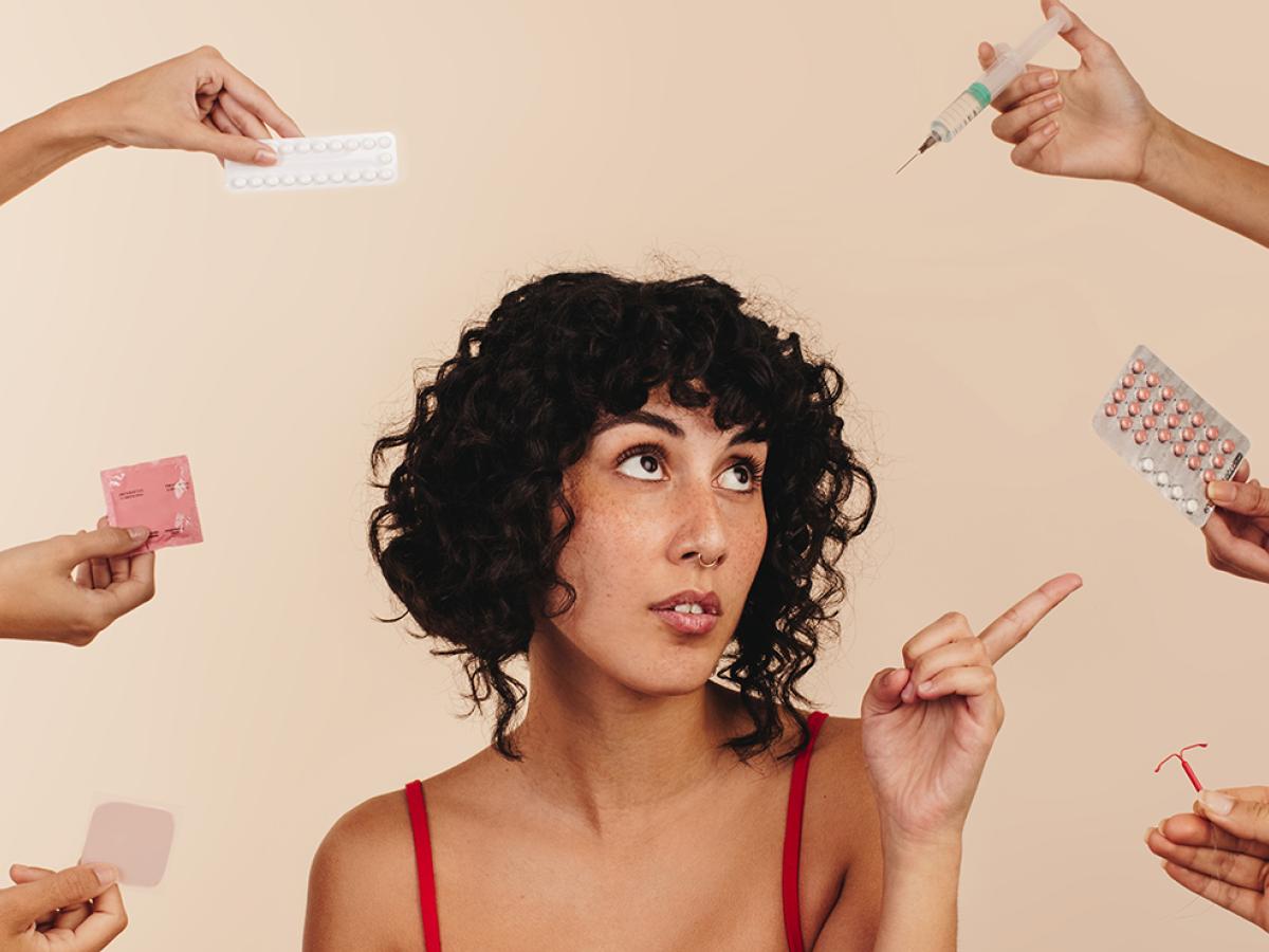 A woman is choosing from a variety of options.