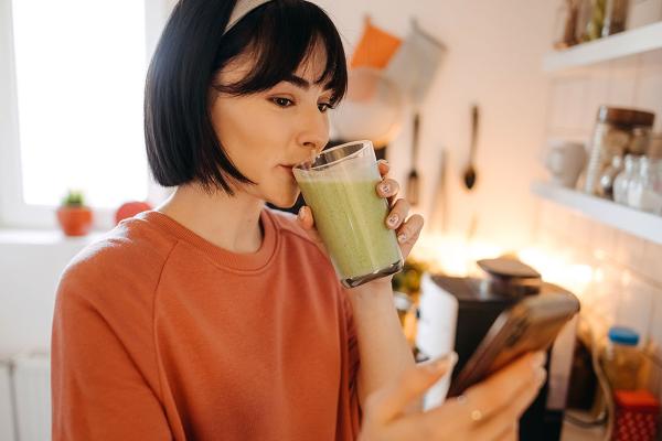 woman drinking a smoothy