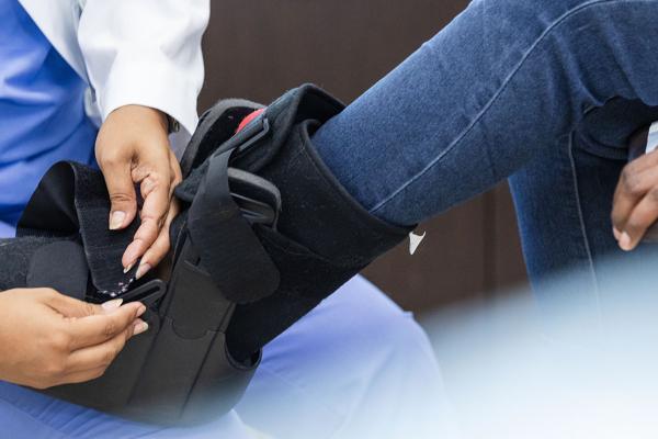 person getting an orthopaedic boot