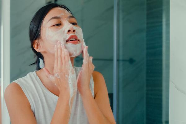 woman washing her face