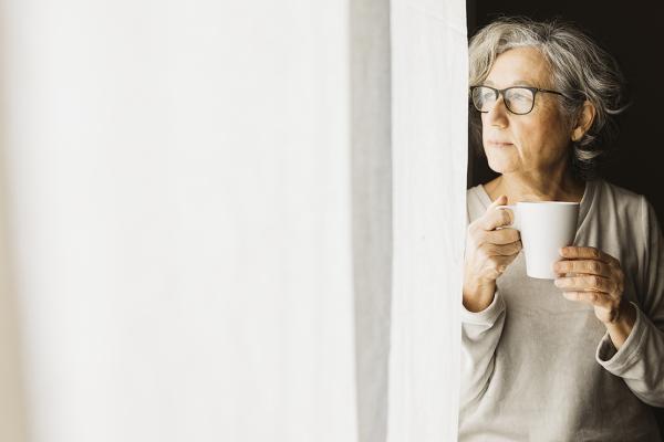 A woman holding a mug.