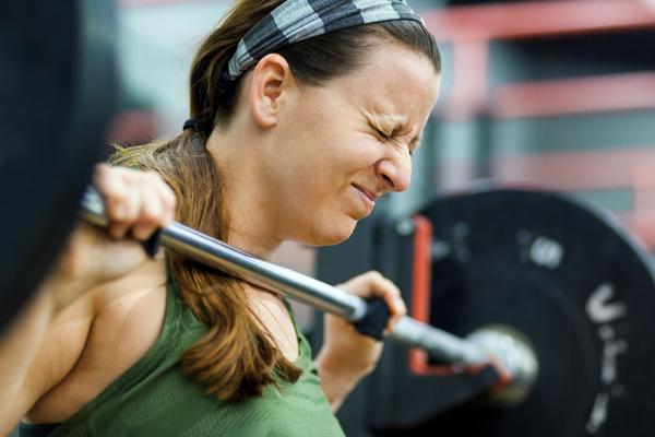 A woman lifting weights.