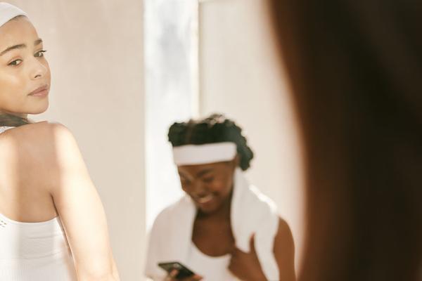 A woman look at herself in the mirror.