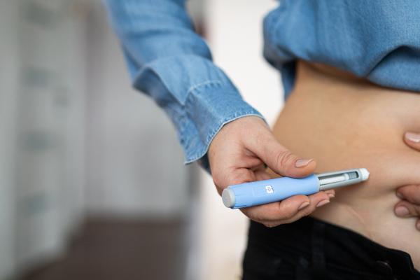 A photo of a person using medicine.