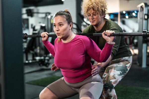 Two women weightlifting
