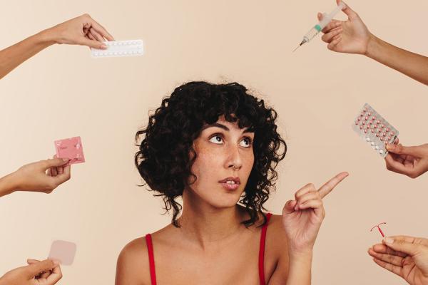 A woman is choosing from a variety of options.