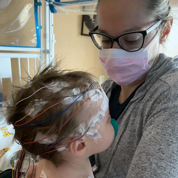 Amanda and her son with EEG electrodes