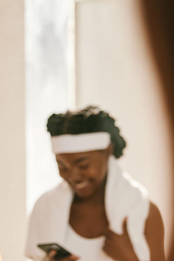A woman look at herself in the mirror.