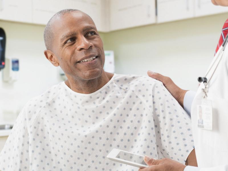 A male patient speaking with his doctor.