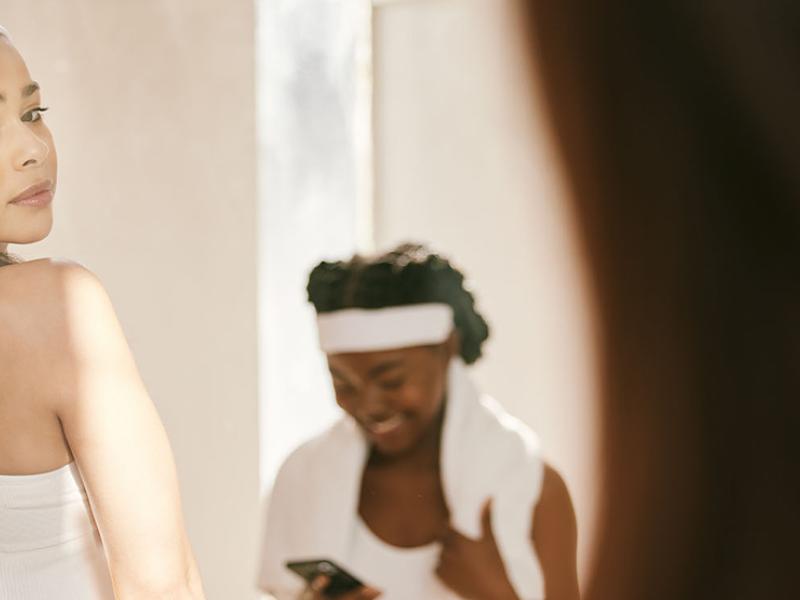 A woman look at herself in the mirror.