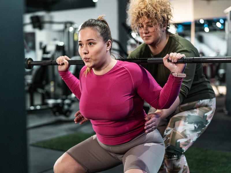 Two women weightlifting