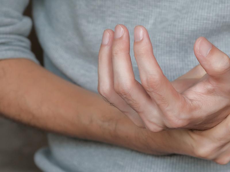A person dealing with achy hands